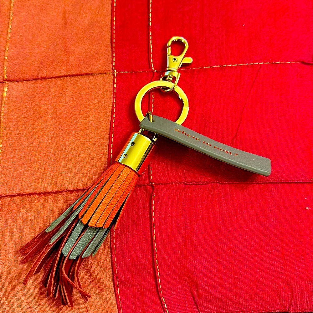 Beautiful key chain with gold metal and leather.